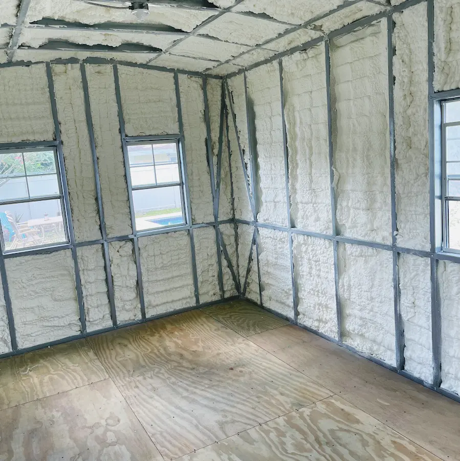 Closed-cell spray foam insulation applied to wall cavities in a residential project in Leisure City